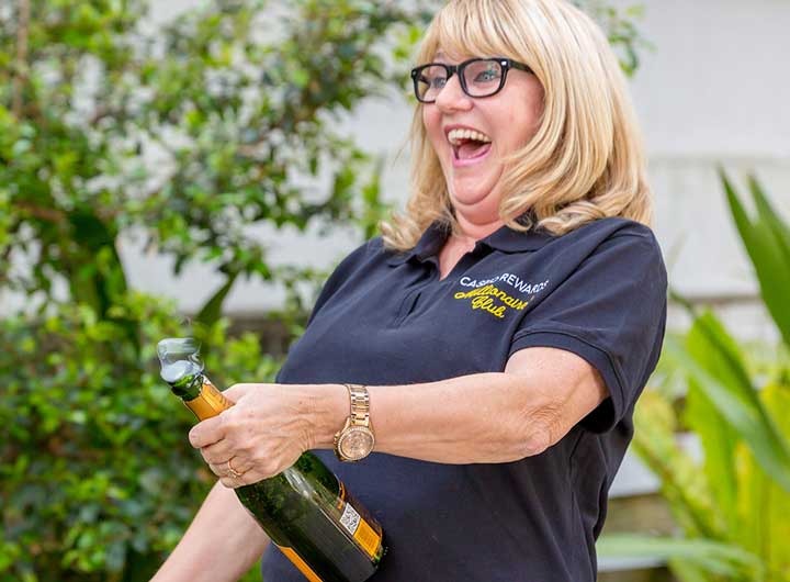 D.P. celebrating with champagne