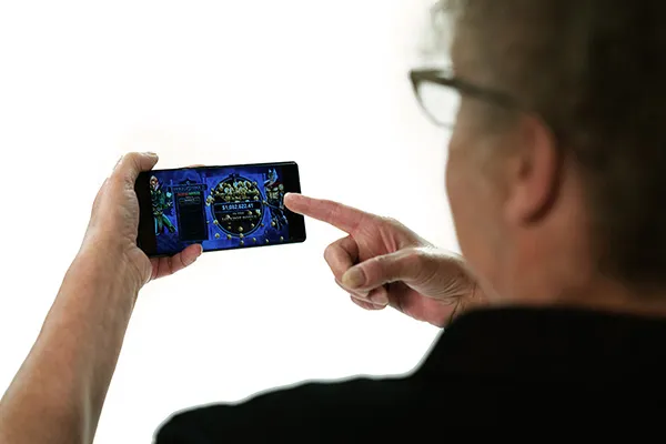 S.B. holding a phone